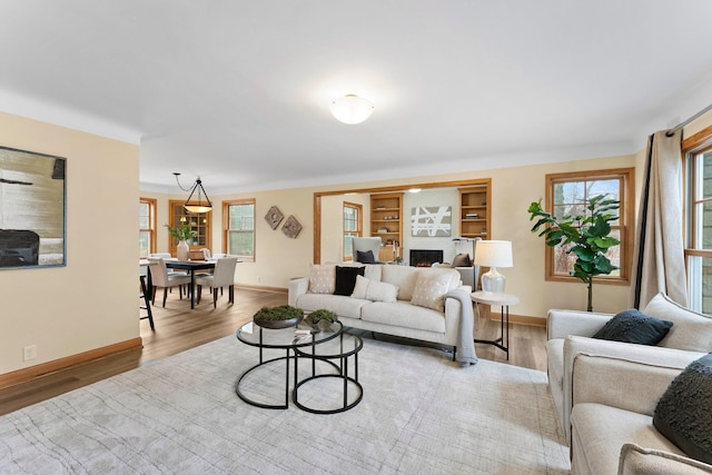 2701 Princeton Ave, Saint Louis Park, MN 55416 - living room with wood finished floors, baseboards, and plenty of natural light