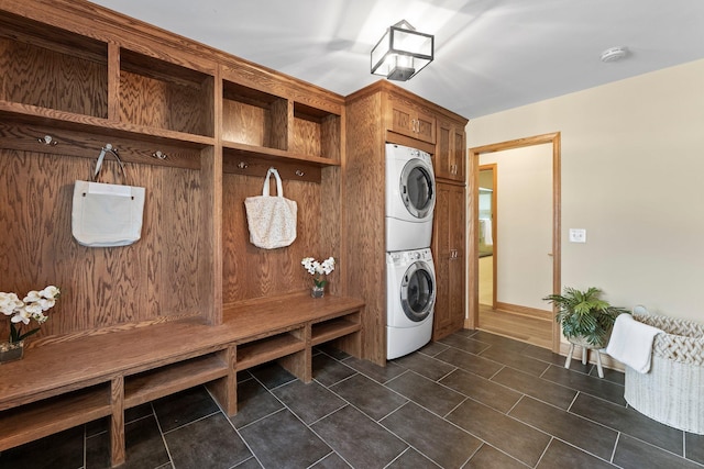 2701 Princeton Ave, Saint Louis Park, MN 55416 - laundry area with stacked washer / drying machine and dark tile patterned flooring
