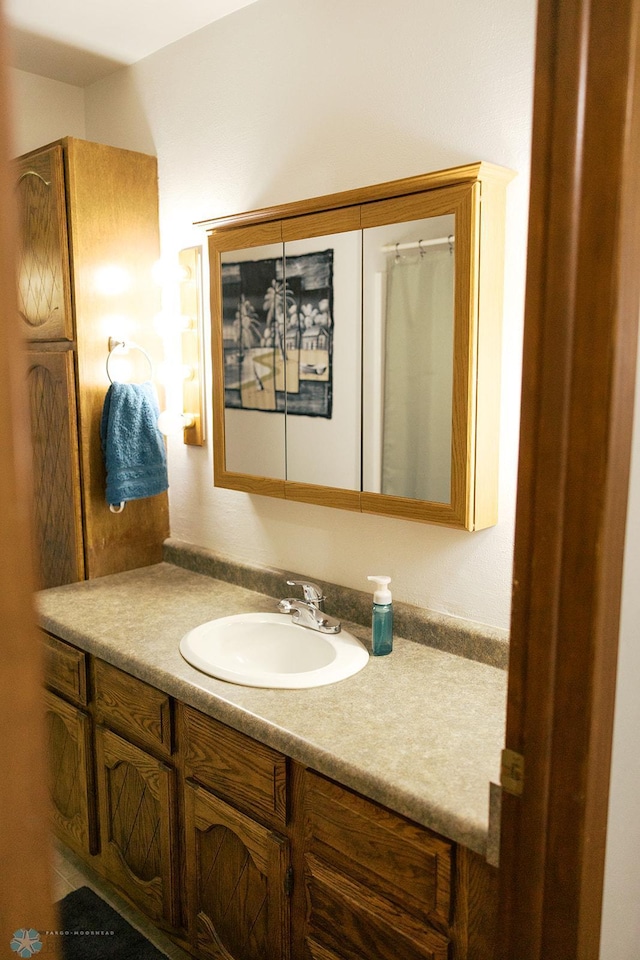806 E St, Bottineau, ND 58318 - full bathroom featuring vanity