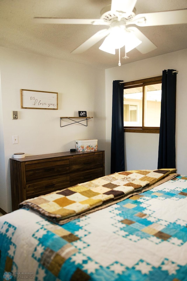 806 E St, Bottineau, ND 58318 - bedroom featuring a ceiling fan