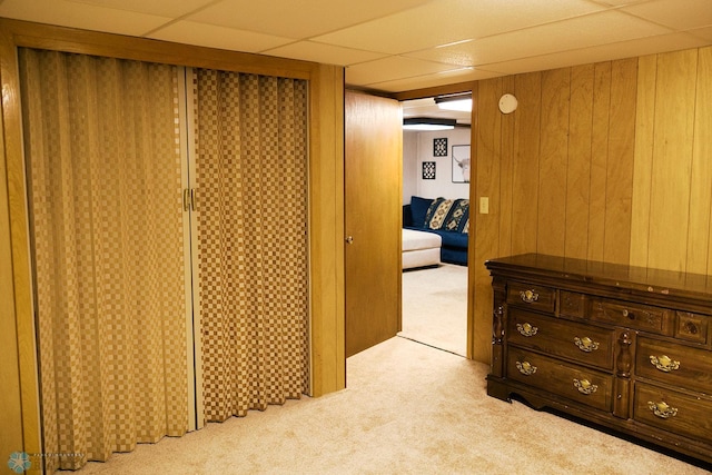 806 E St, Bottineau, ND 58318 - hallway with carpet, wood walls, and a paneled ceiling