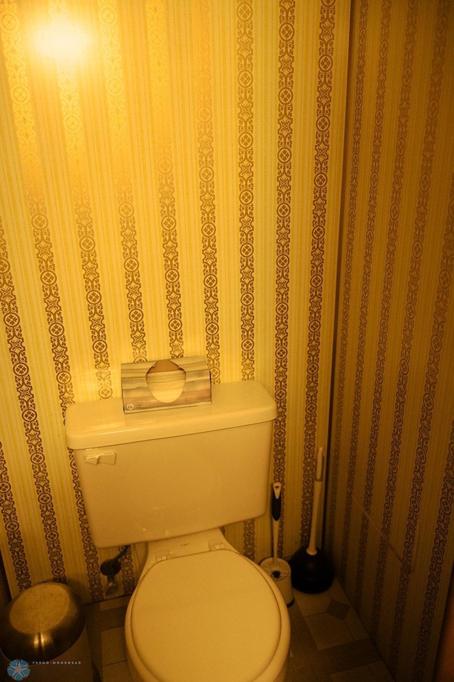806 E St, Bottineau, ND 58318 - bathroom featuring toilet and wallpapered walls
