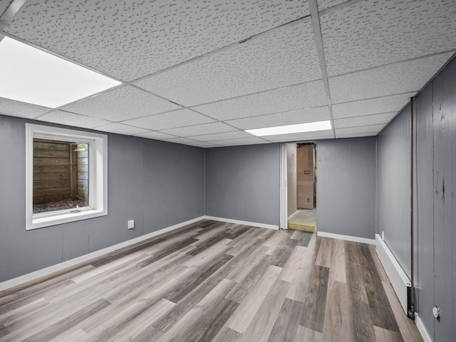5252 5th St NE, Columbia Heights, MN 55421 - below grade area featuring wood finished floors and a drop ceiling