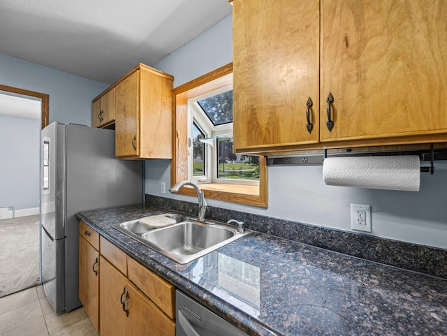 5252 5th St NE, Columbia Heights, MN 55421 - kitchen featuring freestanding refrigerator, dark countertops, light colored carpet, and light tile patterned floors