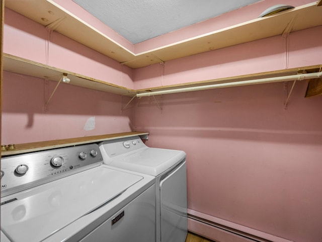 5252 5th St NE, Columbia Heights, MN 55421 - washroom featuring washing machine and dryer and a baseboard heating unit