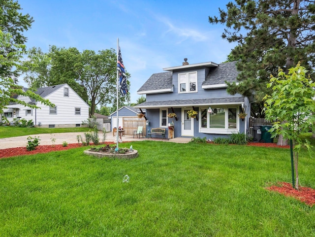 5252 5th St NE, Columbia Heights, MN 55421 - bungalow-style house featuring roof with shingles, a chimney, and covered porch