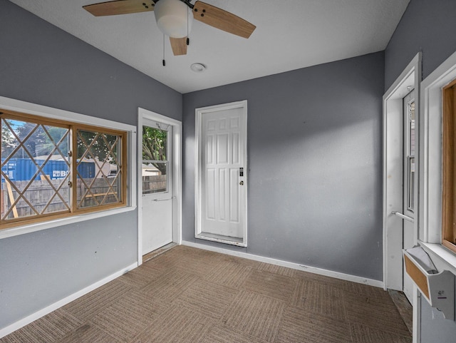 5252 5th St NE, Columbia Heights, MN 55421 - carpeted empty room featuring healthy amount of natural light and a ceiling fan