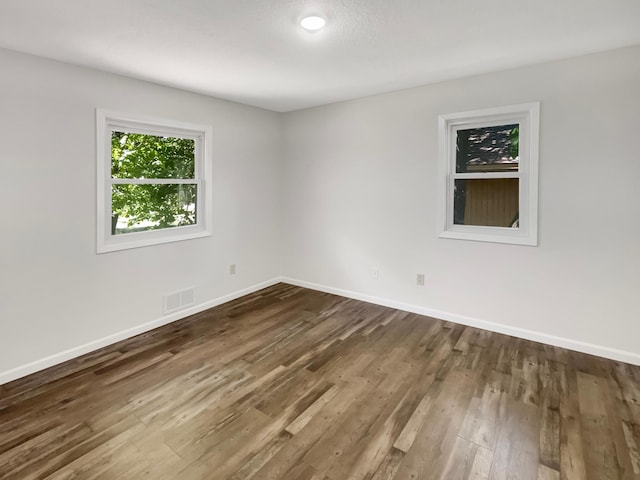 5617 220th St N, Forest Lake, MN 55025 - spare room with dark wood-type flooring and baseboards