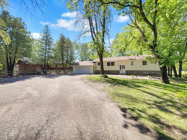 5617 220th St N, Forest Lake, MN 55025 - view of front facade featuring a garage and dirt driveway