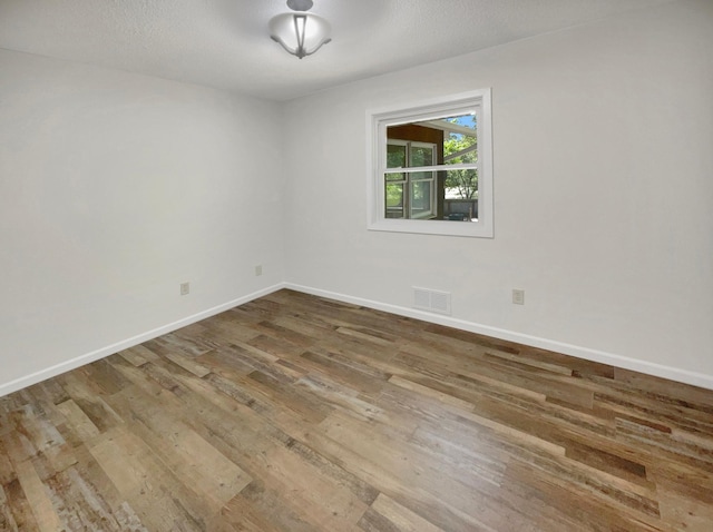 5617 220th St N, Forest Lake, MN 55025 - spare room featuring wood finished floors and baseboards