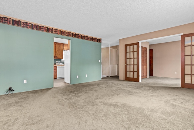 1700 Laramie Trl, Brooklyn Park, MN 55444 - carpeted spare room with french doors and a textured ceiling
