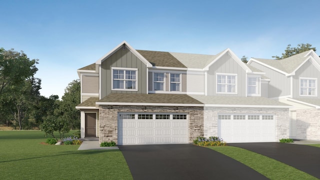 11124 203rd St W, Lakeville, MN 55044 - view of front of house with driveway, a garage, a front yard, stone siding, and board and batten siding