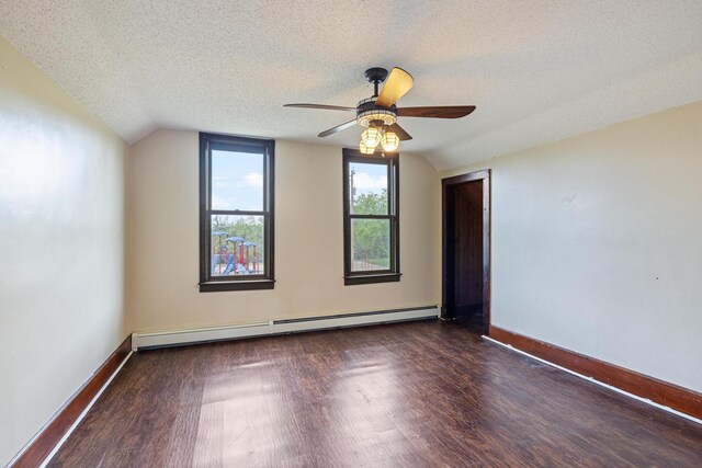 8965 Market St, Sturgeon Lake, MN 55783 - unfurnished room featuring baseboard heating, wood finished floors, a ceiling fan, baseboards, and a textured ceiling