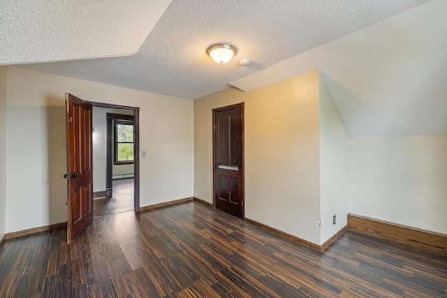 8965 Market St, Sturgeon Lake, MN 55783 - unfurnished room with wood finished floors, a textured ceiling, baseboards, and baseboard heating