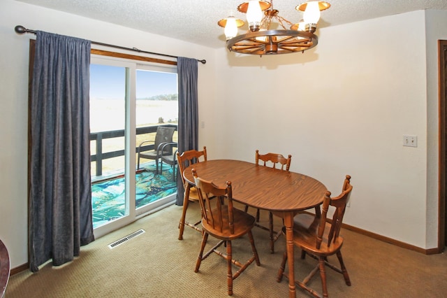 273 Alder Rd, South Haven, MN 55382 - dining area featuring a chandelier, carpet flooring, healthy amount of natural light, and a textured ceiling