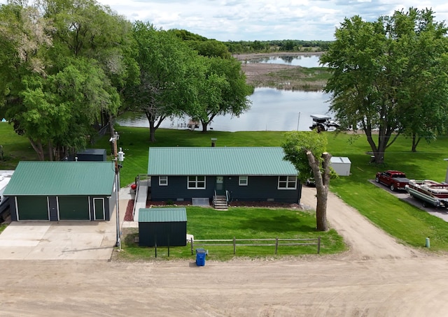 273 Alder Rd, South Haven, MN 55382 - view of front facade featuring a water view, a metal roof, and driveway