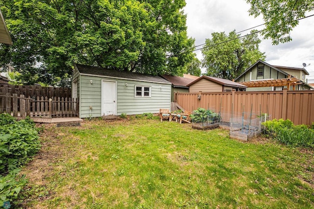 1328 6th St S, Fargo, ND 58103 - view of yard with a garden and an outdoor structure