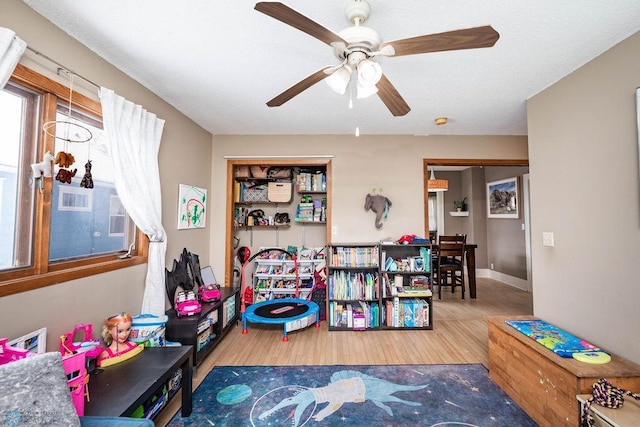 1328 6th St S, Fargo, ND 58103 - game room with wood finished floors, ceiling fan, and baseboards