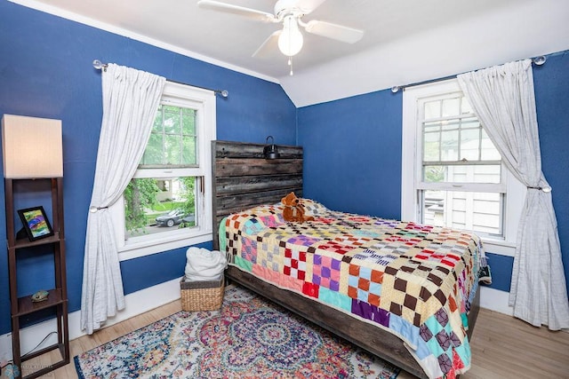 1328 6th St S, Fargo, ND 58103 - bedroom featuring wood finished floors, vaulted ceiling, and ceiling fan