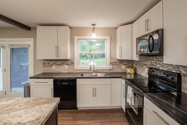 E13680 Stelter Rd, Fall Creek, WI 54742 - kitchen featuring black appliances, a sink, backsplash, dark wood-style floors, and white cabinetry