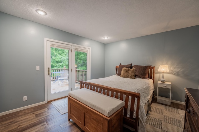 E13680 Stelter Rd, Fall Creek, WI 54742 - bedroom with access to outside, wood finished floors, baseboards, a textured ceiling, and recessed lighting