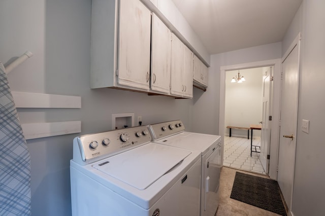 E13680 Stelter Rd, Fall Creek, WI 54742 - laundry area featuring washing machine and clothes dryer, cabinet space, and a chandelier