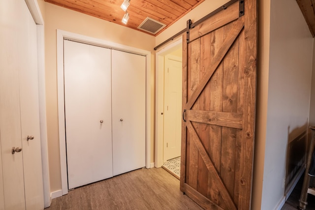 E13680 Stelter Rd, Fall Creek, WI 54742 - detailed view of wood ceiling, wood finished floors, and a barn door