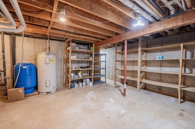E13680 Stelter Rd, Fall Creek, WI 54742 - unfinished basement featuring electric water heater and a water pressure tank
