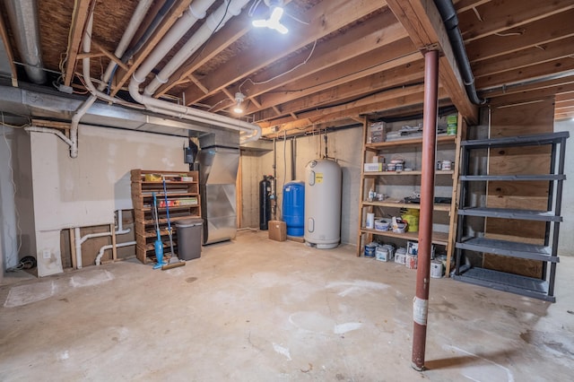 E13680 Stelter Rd, Fall Creek, WI 54742 - unfinished basement with a water pressure tank, water heater, and heating unit