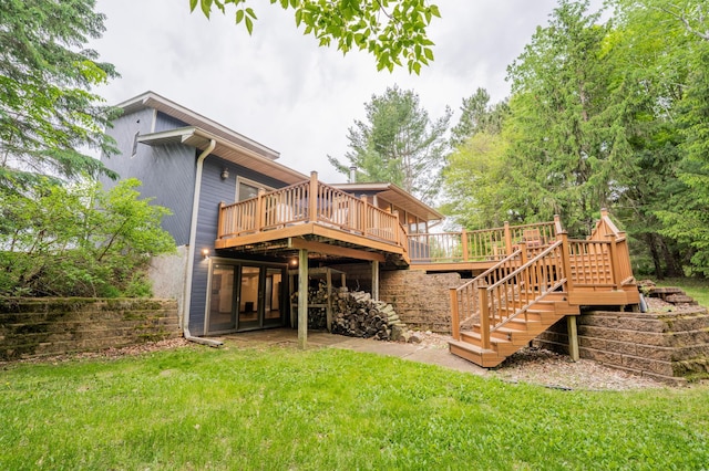 E13680 Stelter Rd, Fall Creek, WI 54742 - rear view of property featuring a wooden deck, a lawn, and stairs