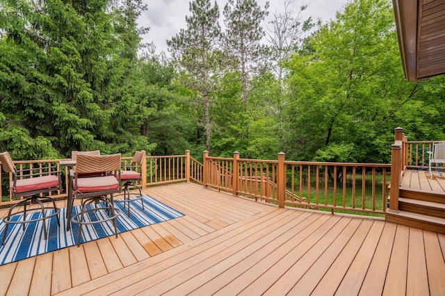 E13680 Stelter Rd, Fall Creek, WI 54742 - wooden deck featuring outdoor dining area and view of scattered trees
