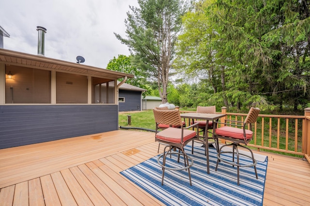 E13680 Stelter Rd, Fall Creek, WI 54742 - wooden terrace with outdoor dining area and view of wooded area
