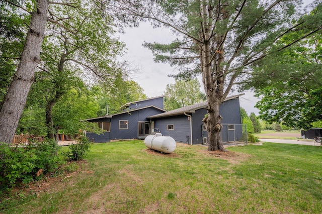 E13680 Stelter Rd, Fall Creek, WI 54742 - rear view of property with a yard and a wooden deck
