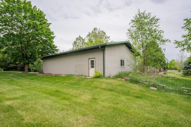 E13680 Stelter Rd, Fall Creek, WI 54742 - view of side of property featuring a yard, an outbuilding, and an outdoor structure