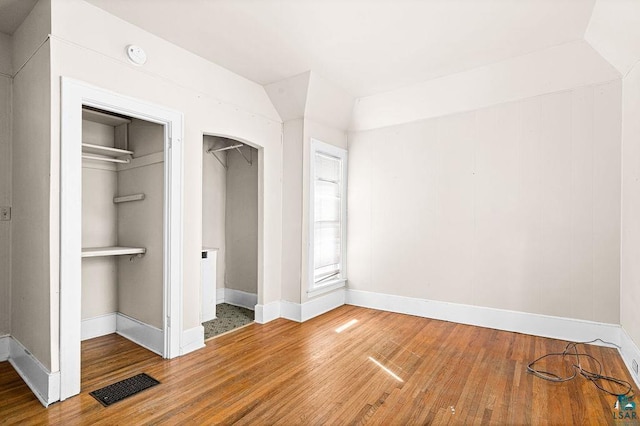 220 12th Ave E, Duluth, MN 55805 - unfurnished bedroom featuring wood finished floors, baseboards, and a closet