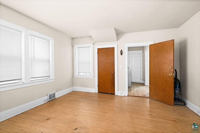 220 12th Ave E, Duluth, MN 55805 - unfurnished bedroom with light wood-style flooring and baseboards