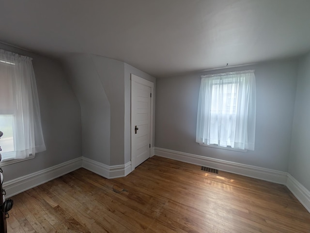 1713 Penn Ave N, Minneapolis, MN 55411 - additional living space featuring wood finished floors, baseboards, and vaulted ceiling