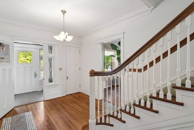 226 Grotto St S, Saint Paul, MN 55105 - entryway featuring a chandelier, wood-type flooring, stairs, and crown molding