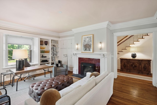 226 Grotto St S, Saint Paul, MN 55105 - living room featuring crown molding, wood finished floors, a brick fireplace, and stairway