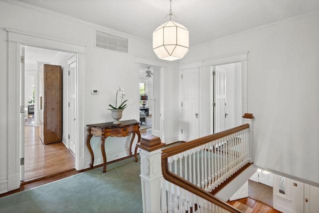 226 Grotto St S, Saint Paul, MN 55105 - hallway with an upstairs landing, crown molding, and baseboards
