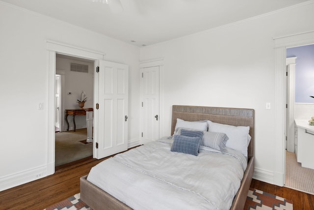 226 Grotto St S, Saint Paul, MN 55105 - bedroom with wood finished floors, crown molding, and baseboards