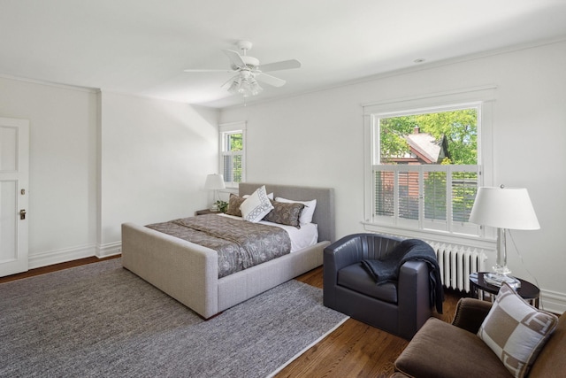 226 Grotto St S, Saint Paul, MN 55105 - bedroom with radiator, multiple windows, wood finished floors, and ceiling fan
