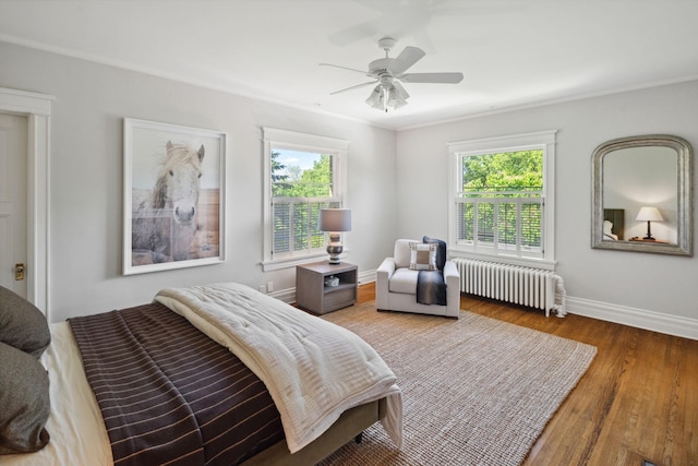 226 Grotto St S, Saint Paul, MN 55105 - bedroom featuring radiator, wood finished floors, baseboards, and ceiling fan