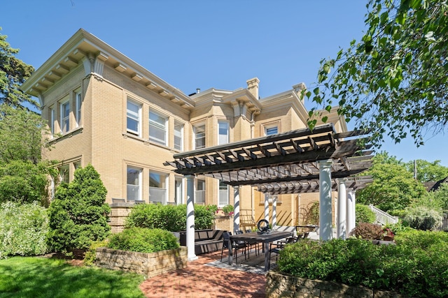 226 Grotto St S, Saint Paul, MN 55105 - back of house with a pergola and a patio