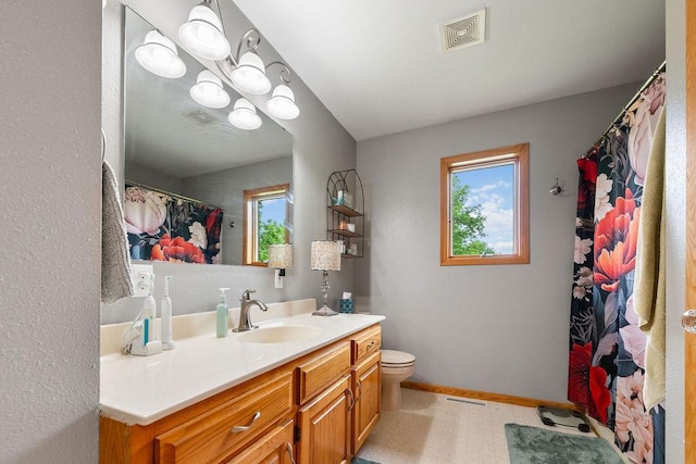 21750 County 36, Reynolds Twp, MN 56347 - bathroom featuring vanity, toilet, baseboards, and curtained shower