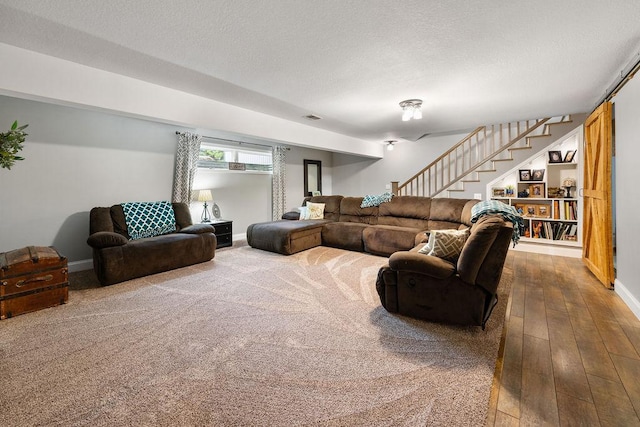 21750 County 36, Reynolds Twp, MN 56347 - living area featuring stairs, hardwood / wood-style floors, baseboards, and a textured ceiling