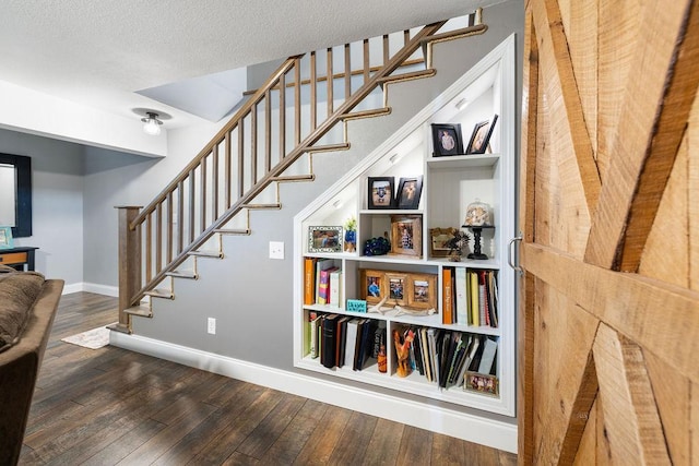 21750 County 36, Reynolds Twp, MN 56347 - stairs with wood finished floors, baseboards, and a textured ceiling