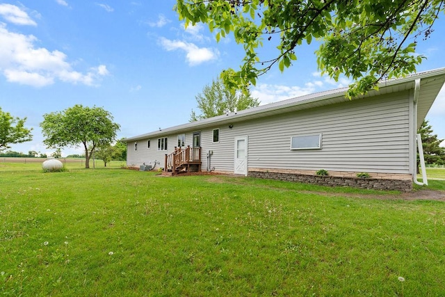 21750 County 36, Reynolds Twp, MN 56347 - rear view of house featuring a yard