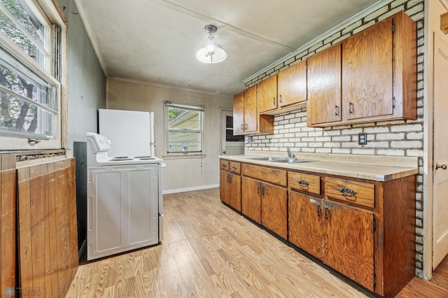 1550 13 1/2 St S, Fargo, ND 58103 - kitchen featuring electric stove, freestanding refrigerator, light countertops, a sink, and light wood finished floors