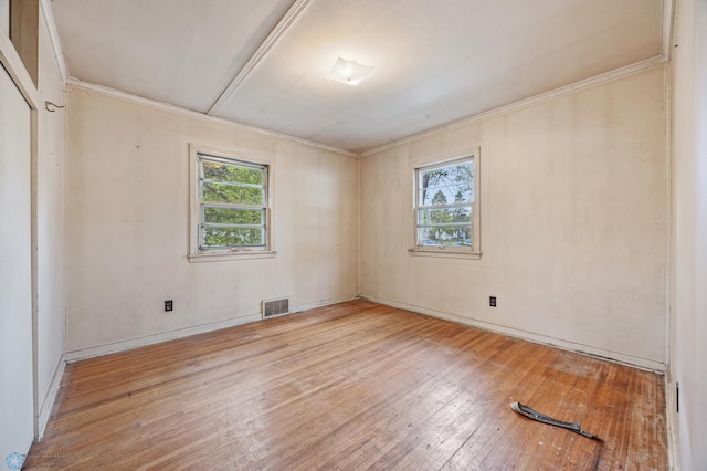 1550 13 1/2 St S, Fargo, ND 58103 - unfurnished room featuring healthy amount of natural light, wood-type flooring, ornamental molding, and baseboards